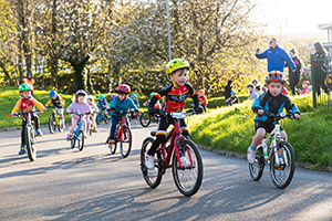 Kids cycling at NSC looking excited